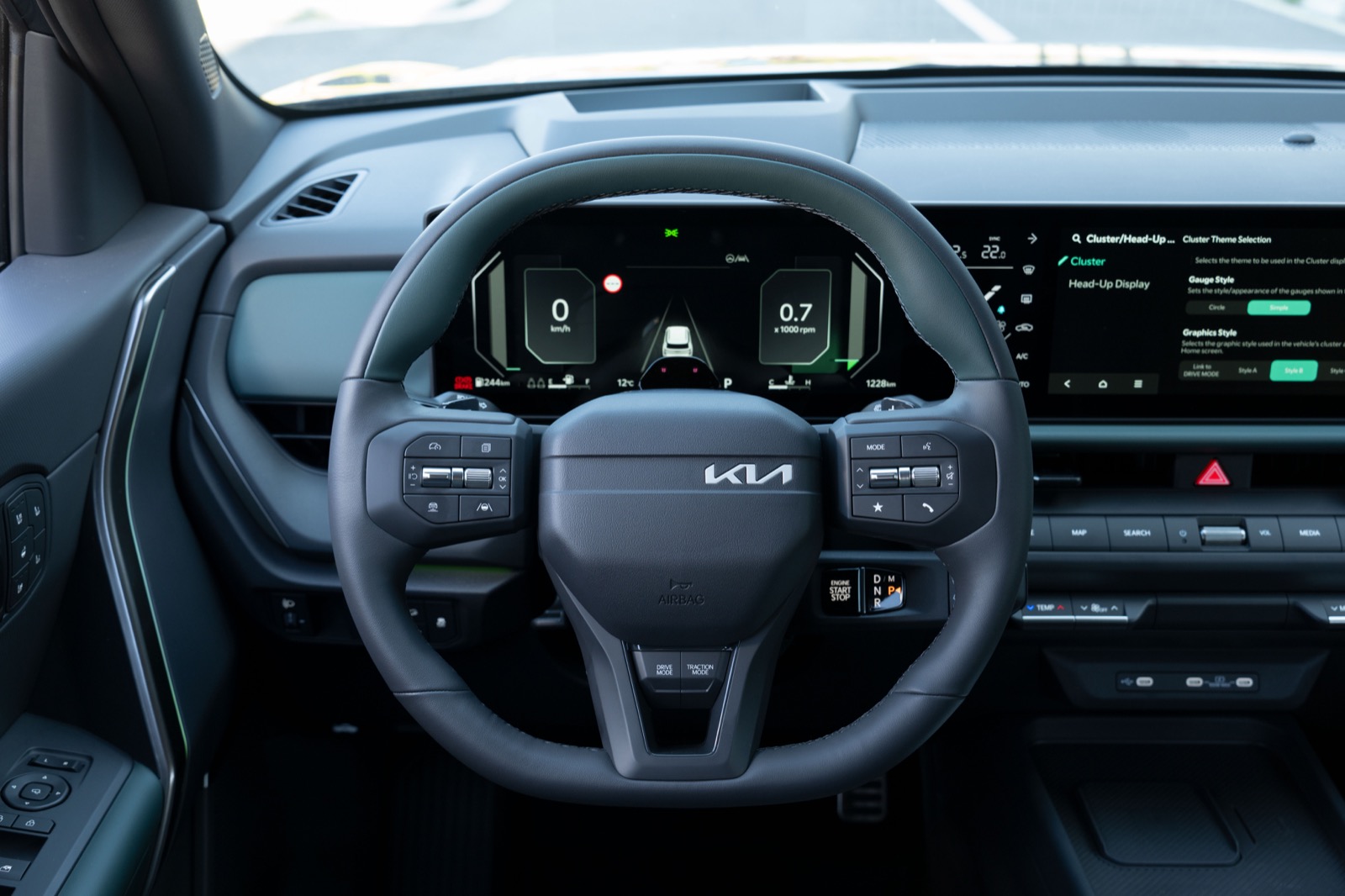 2027 Kia Seltos dashboard, steering wheel and twin displays, official Kia press photography.