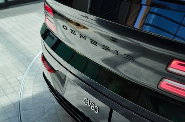 Close-up of the Genesis GV80's rear badge and taillights.