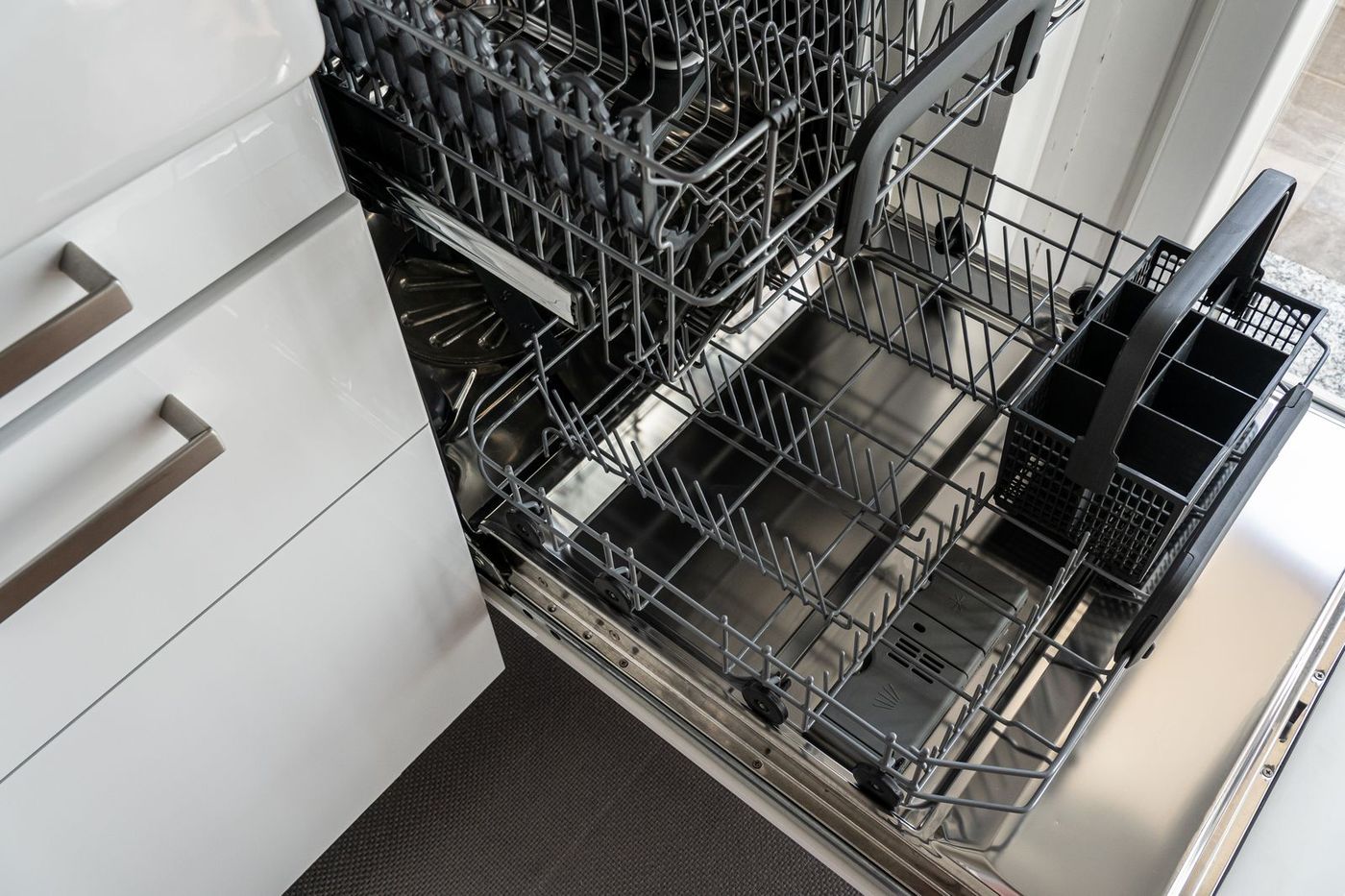 Open dishwasher showing the racks