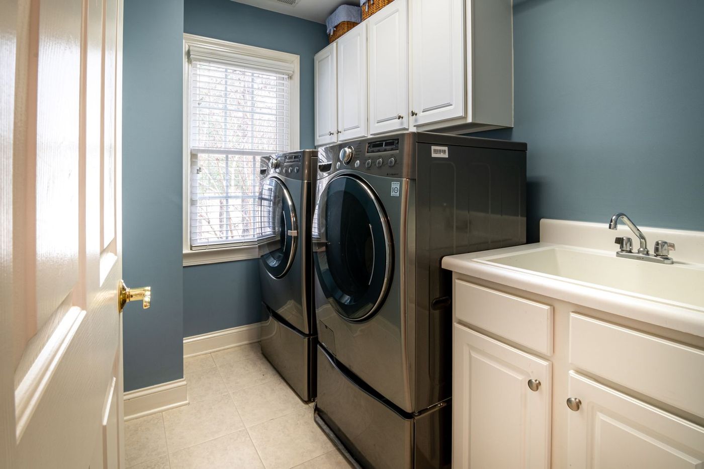 Laundry room with a front-loading washer and dryer