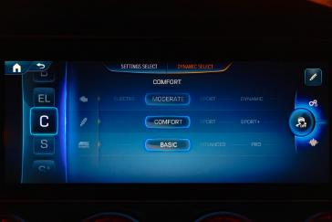 Mercedes-AMG GT 4-Door Coupe infotainment screen showing Dynamic Select drive mode settings.