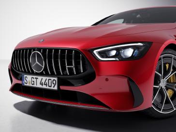 Close-up of the Mercedes-AMG GT 4-Door Coupe's grille and front wheel.