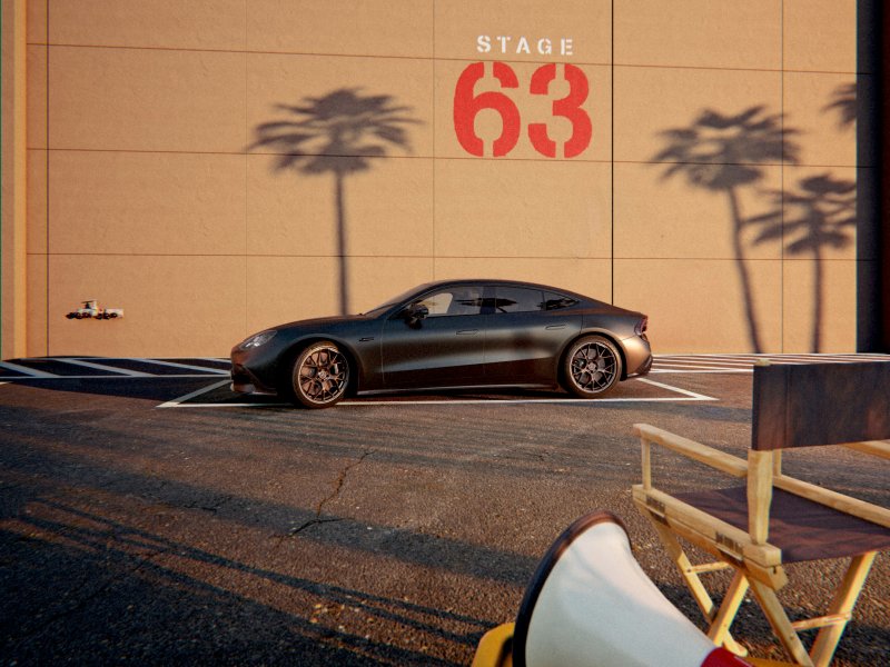 Side profile of the Mercedes-AMG GT 63 4-Door Coupe parked against a wall reading Stage 63.