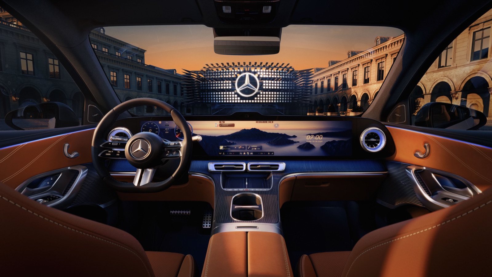 The GLC dashboard seen from the rear seat, the optional MBUX Hyperscreen running pillar to pillar above a tan leather interior.