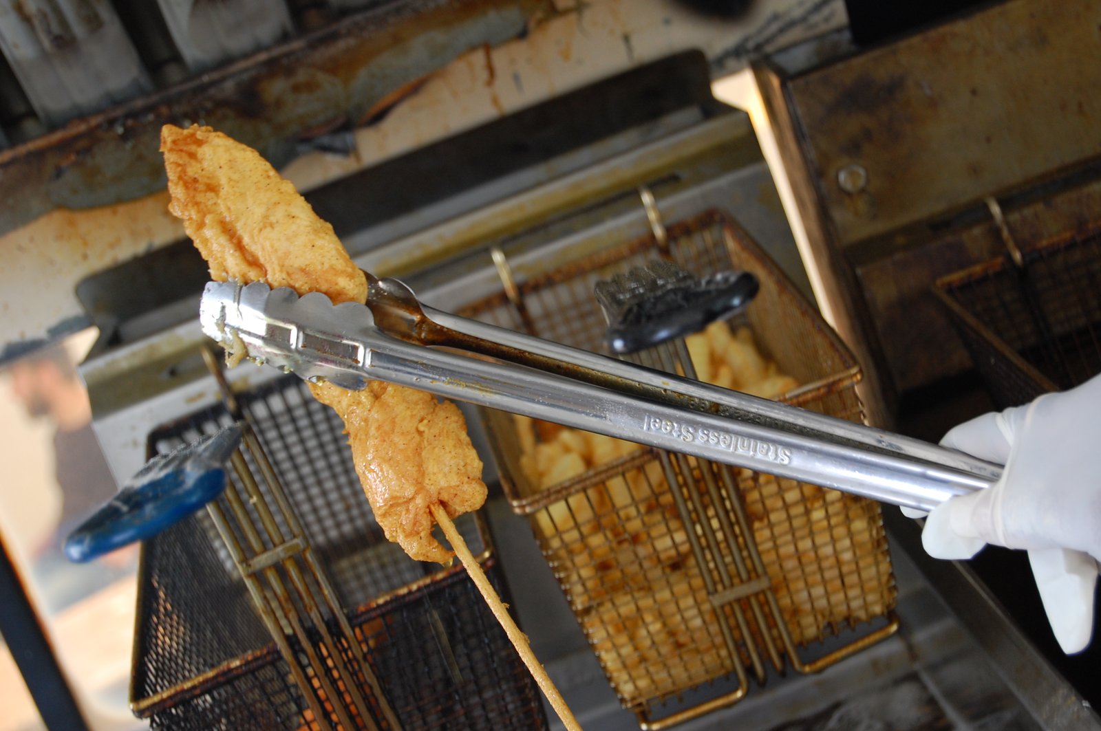 Nashville hot chicken fresh out of the fryer, a real photograph.
