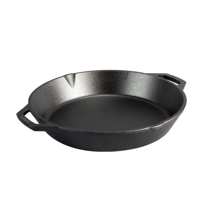 A cast iron skillet on a white table.