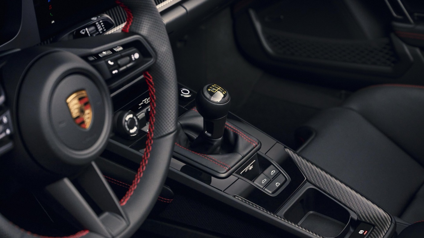 The six-speed manual gear lever and steering wheel inside the Porsche 911 GT3 S/C.