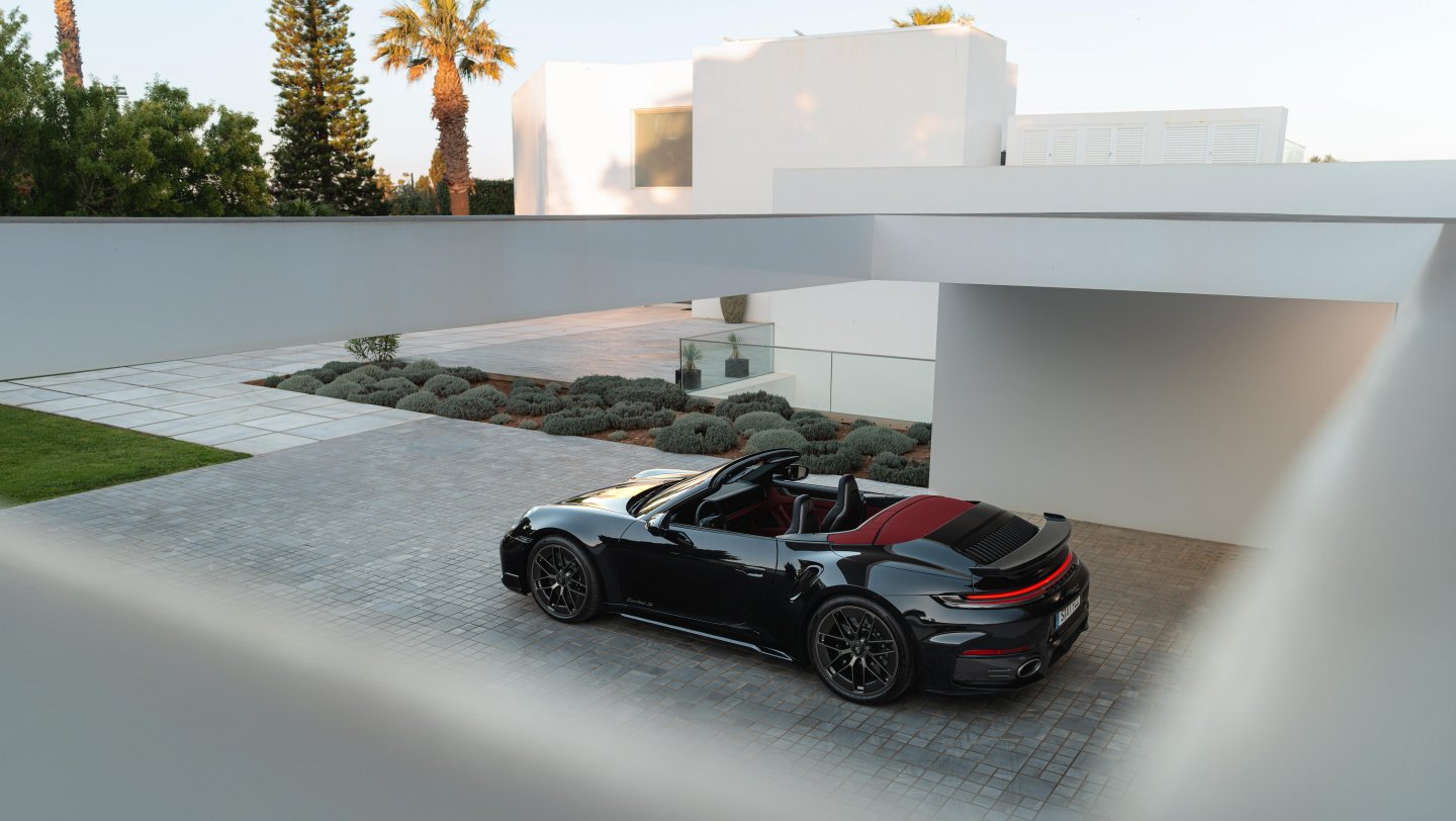 Overhead view of the 911 Turbo S Cabriolet, showing its red interior.