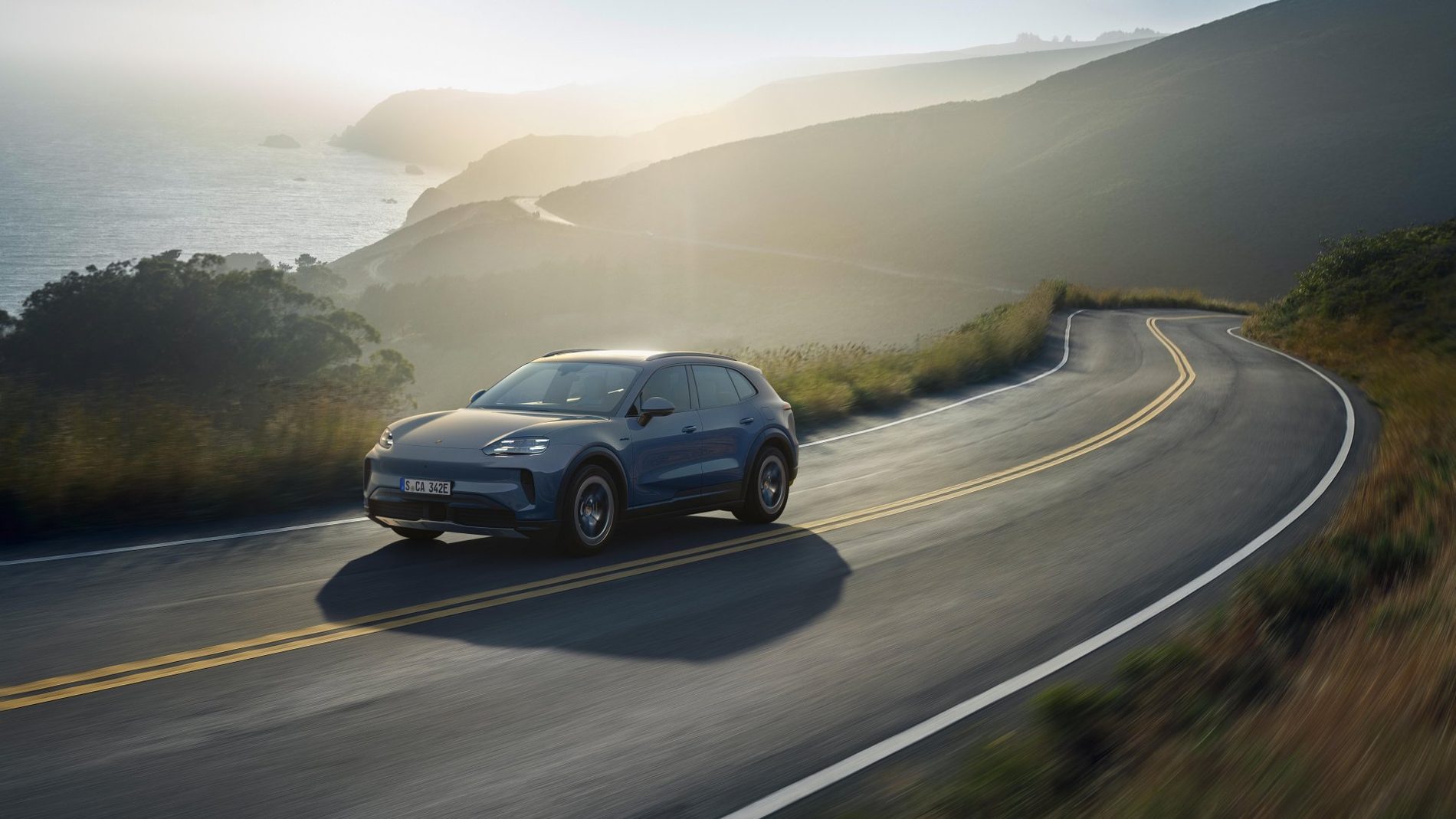 Porsche Cayenne S Electric photographed in three-quarter view.