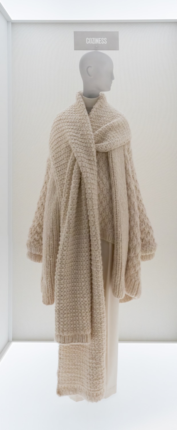 A knit sweater and scarf by The Row, displayed at the Met.
