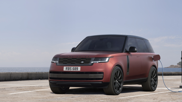 Range Rover SV plug-in hybrid charging, front three-quarter view.