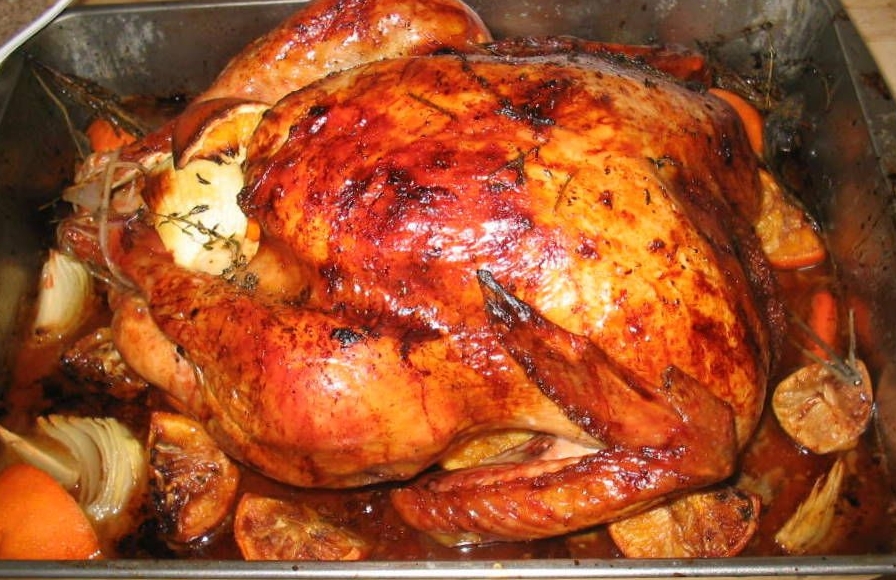 A whole roasted turkey that was wet-brined before cooking, real photograph.