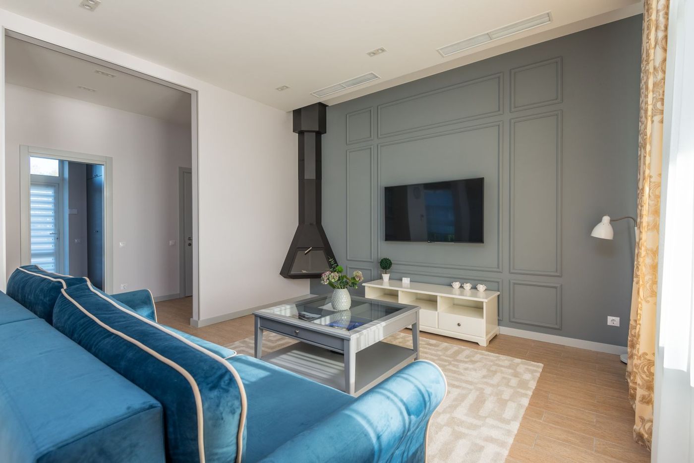 Bright living room with a wall-mounted television