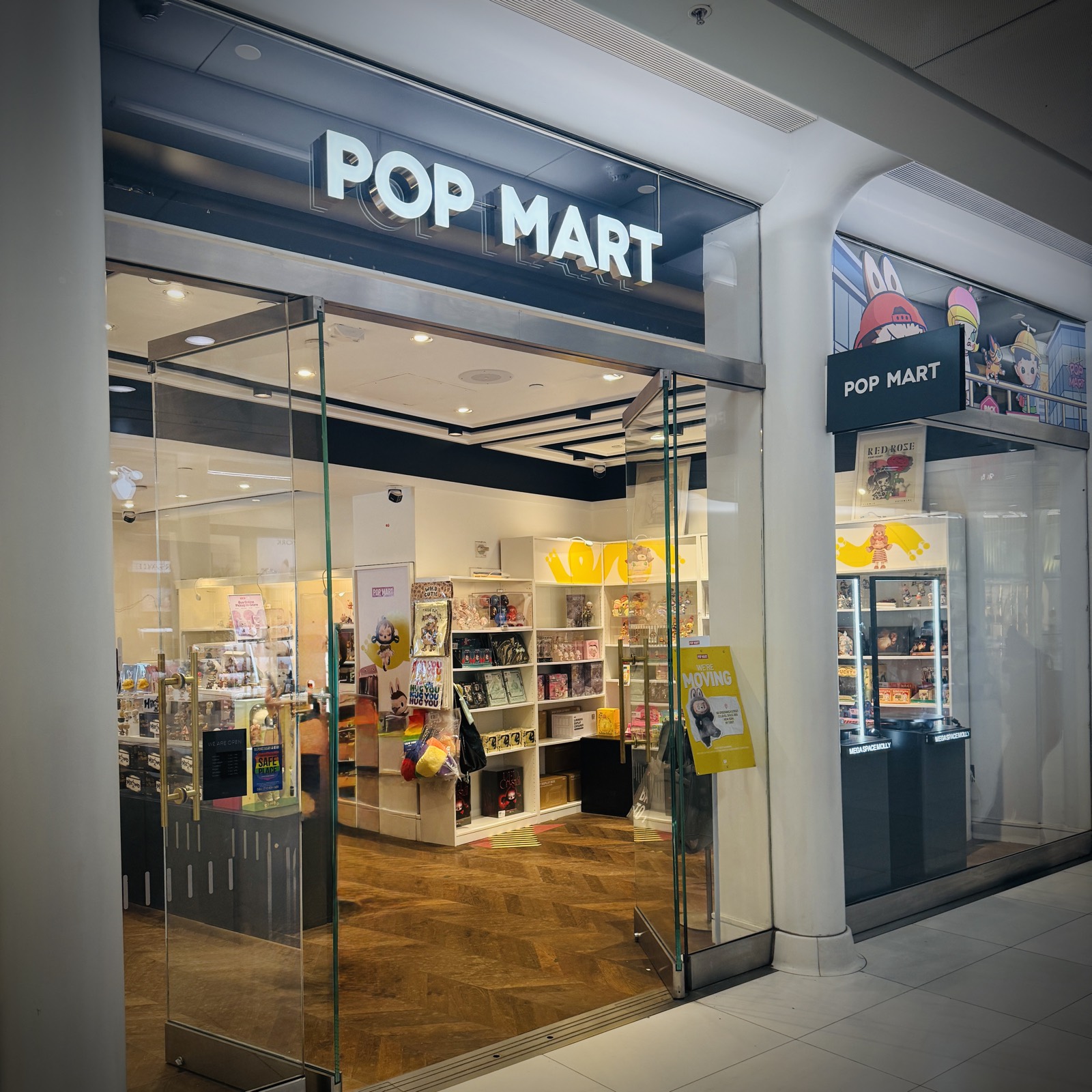 The entrance of an official Pop Mart retail store, real photograph.