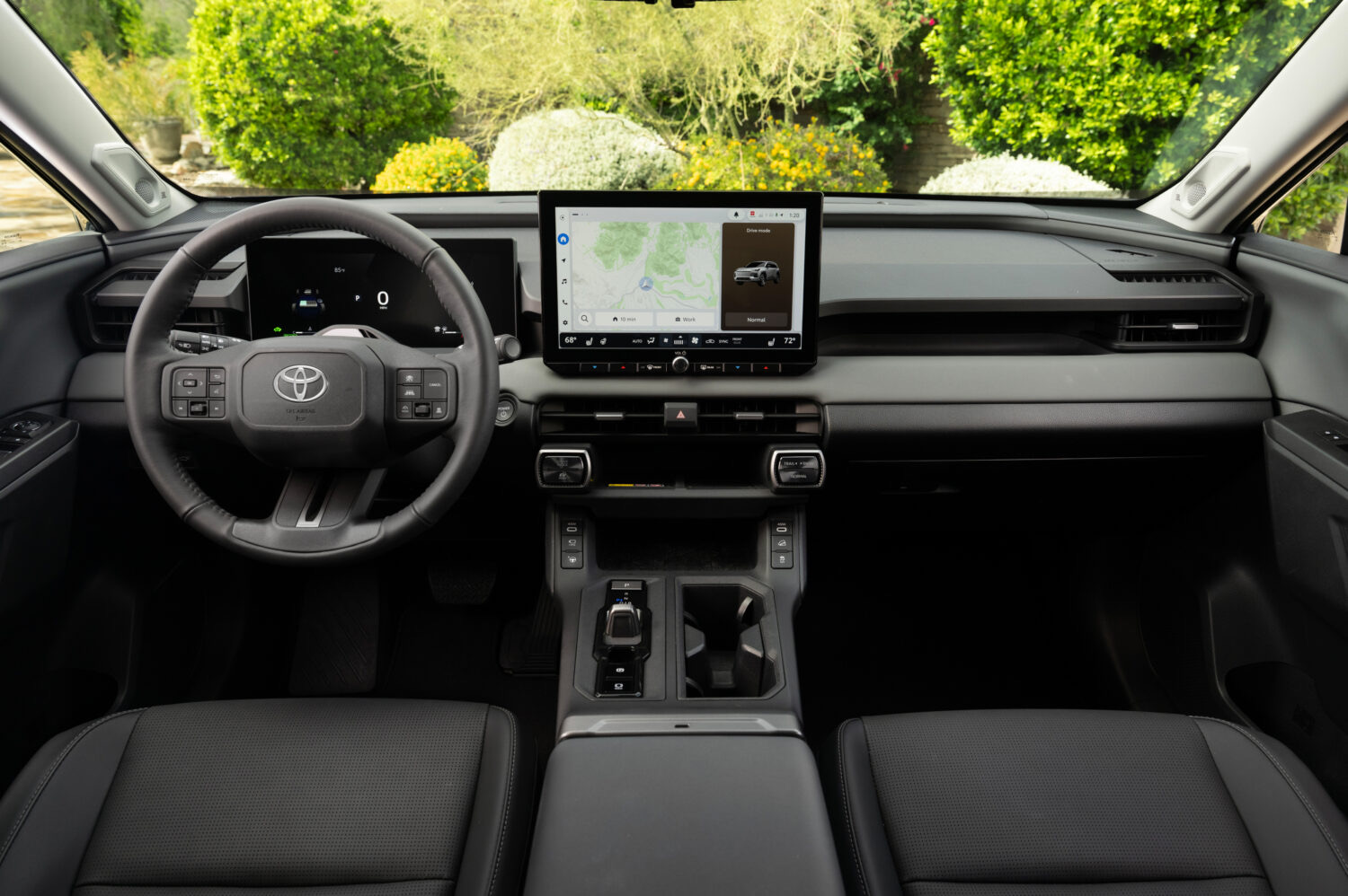 The all-new Toyota RAV4 dashboard and steering wheel, official Toyota press photography.