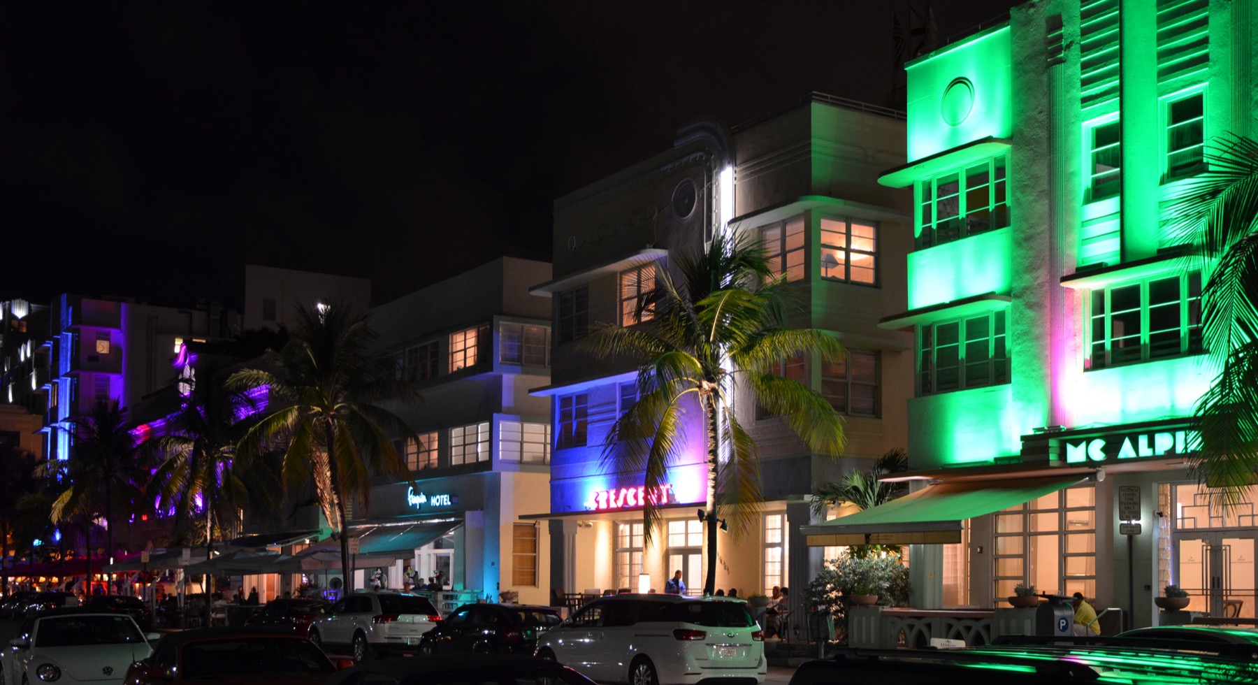 Ocean Drive in Miami Beach lit by neon at night — the real Vice City.