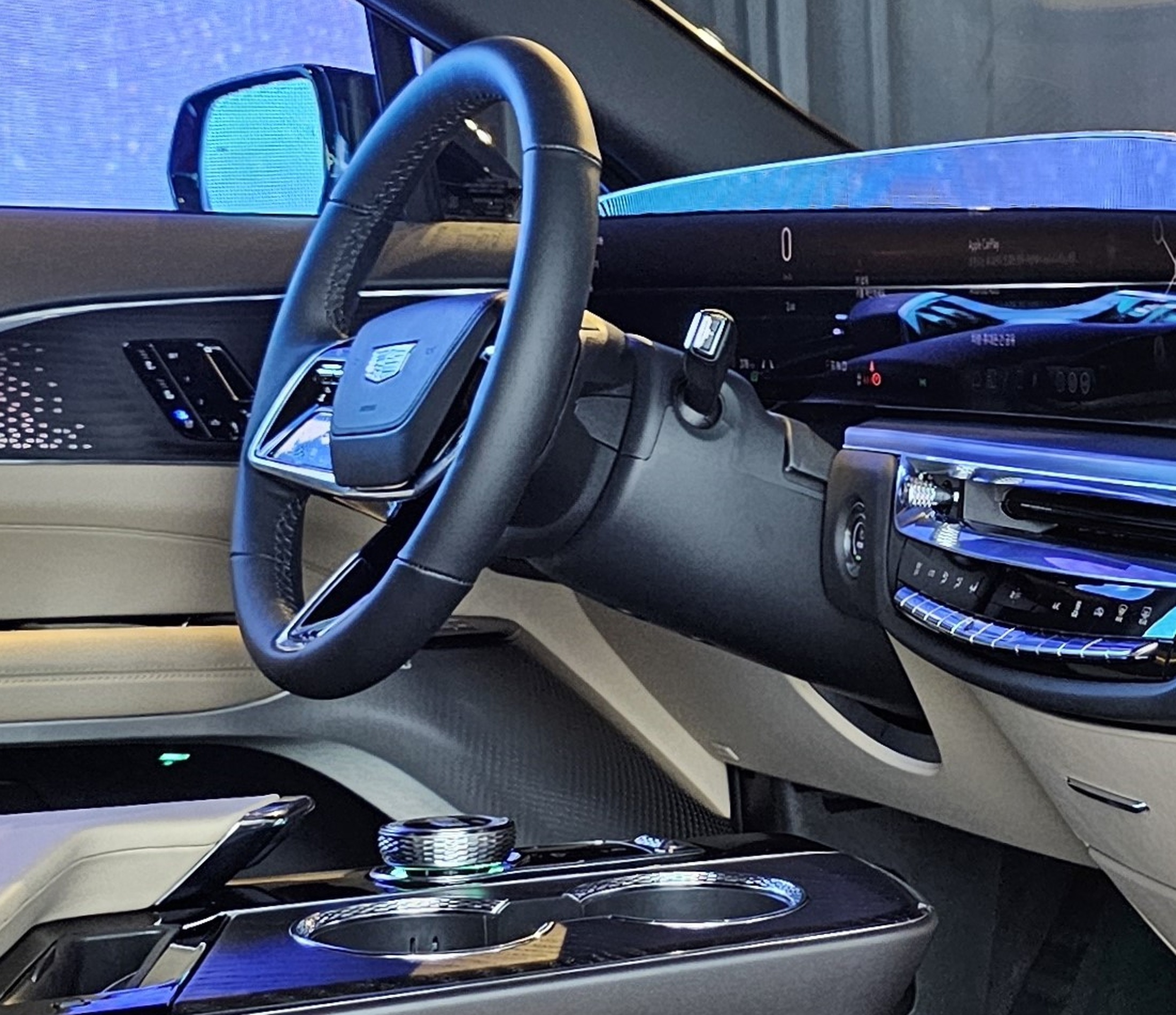 Cadillac Lyriq steering wheel closeup showing haptic touch controls.