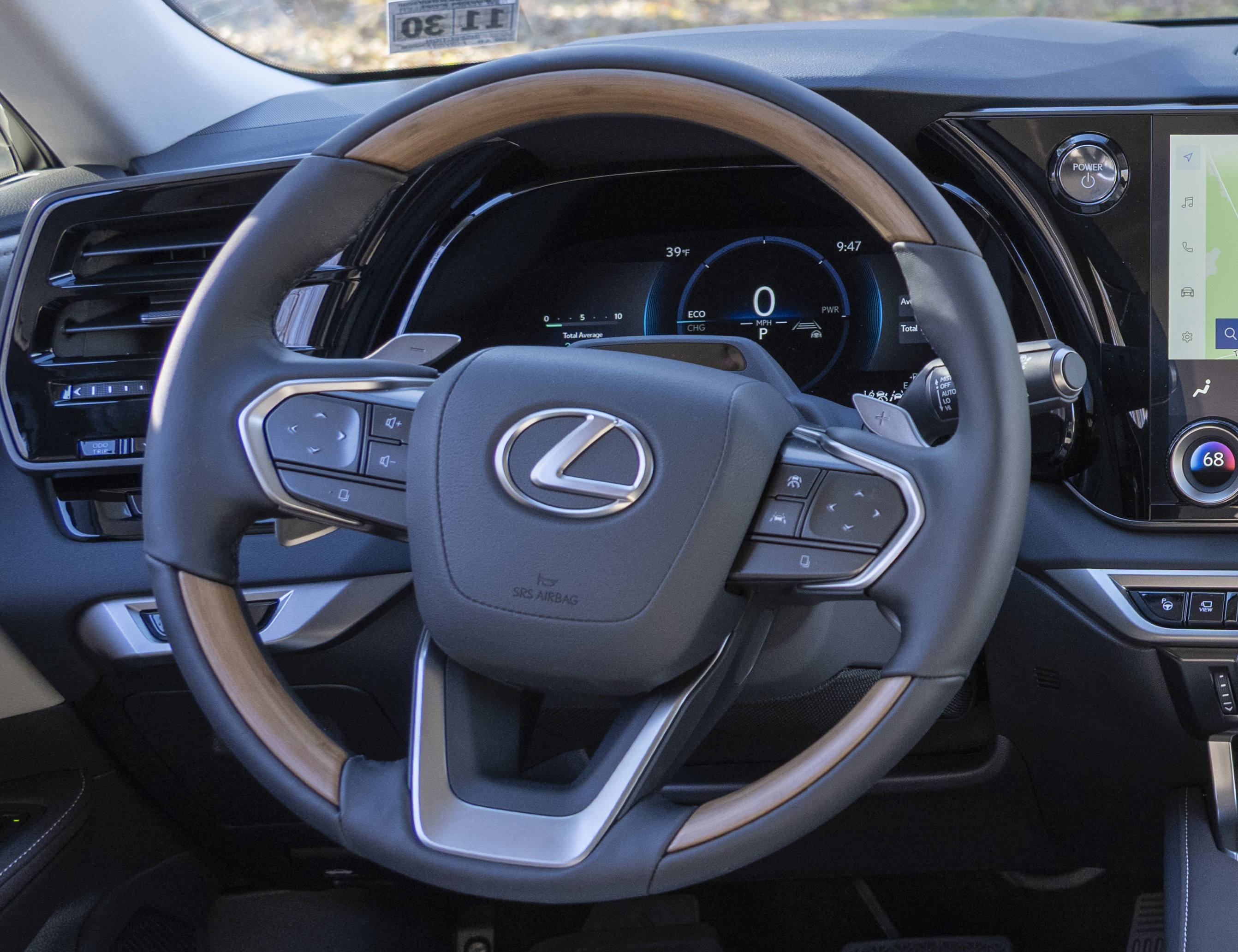 2026 Lexus RX steering wheel closeup showing capacitive touch controls.