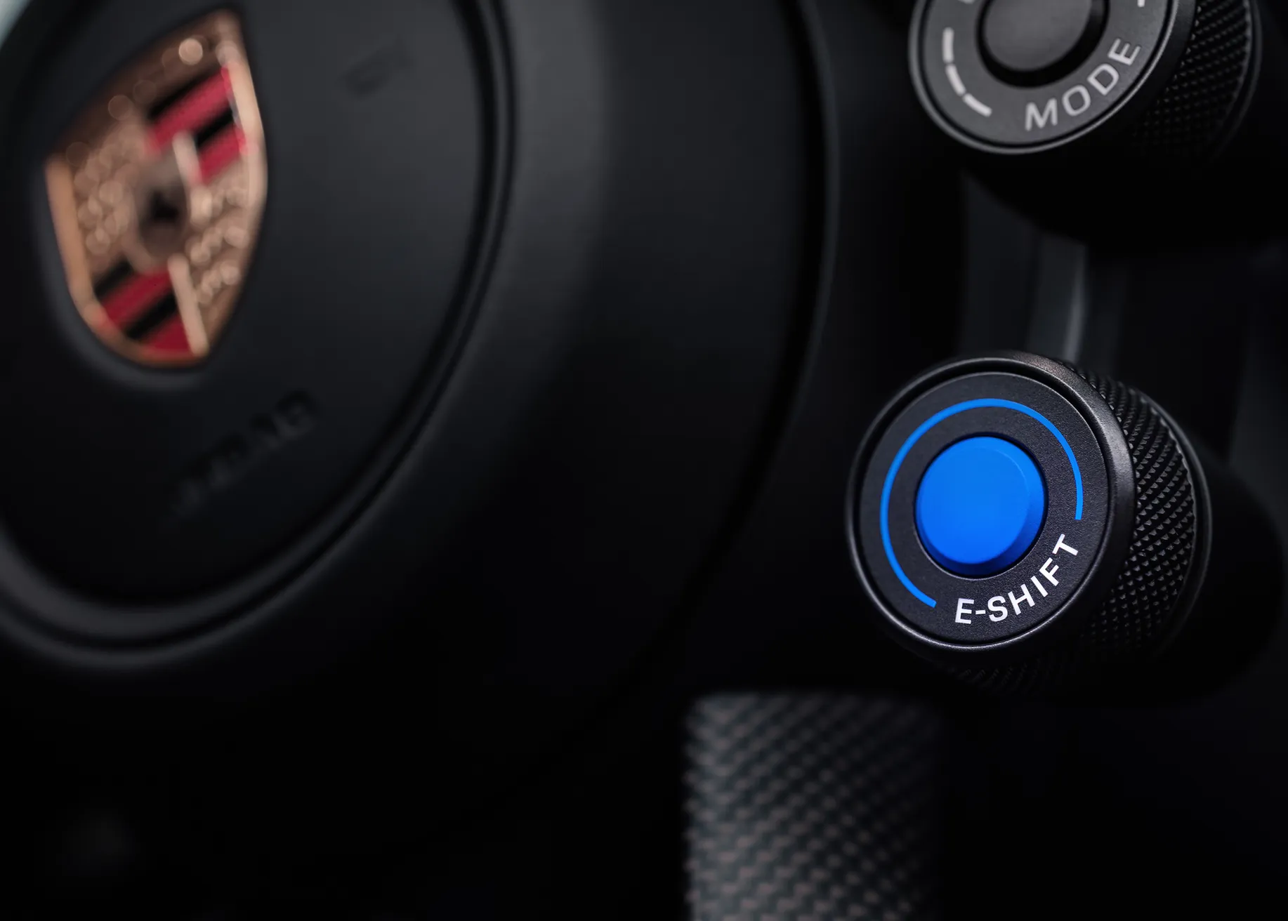Porsche Taycan dedicated steering wheel press photo.