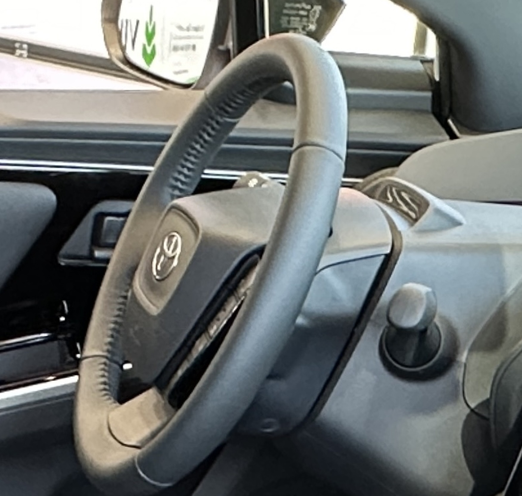 Toyota bZ4X steering wheel closeup.