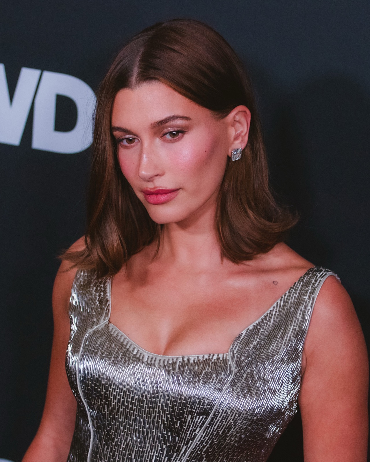 Hailey Bieber at the WWD Style Awards, a real photograph.