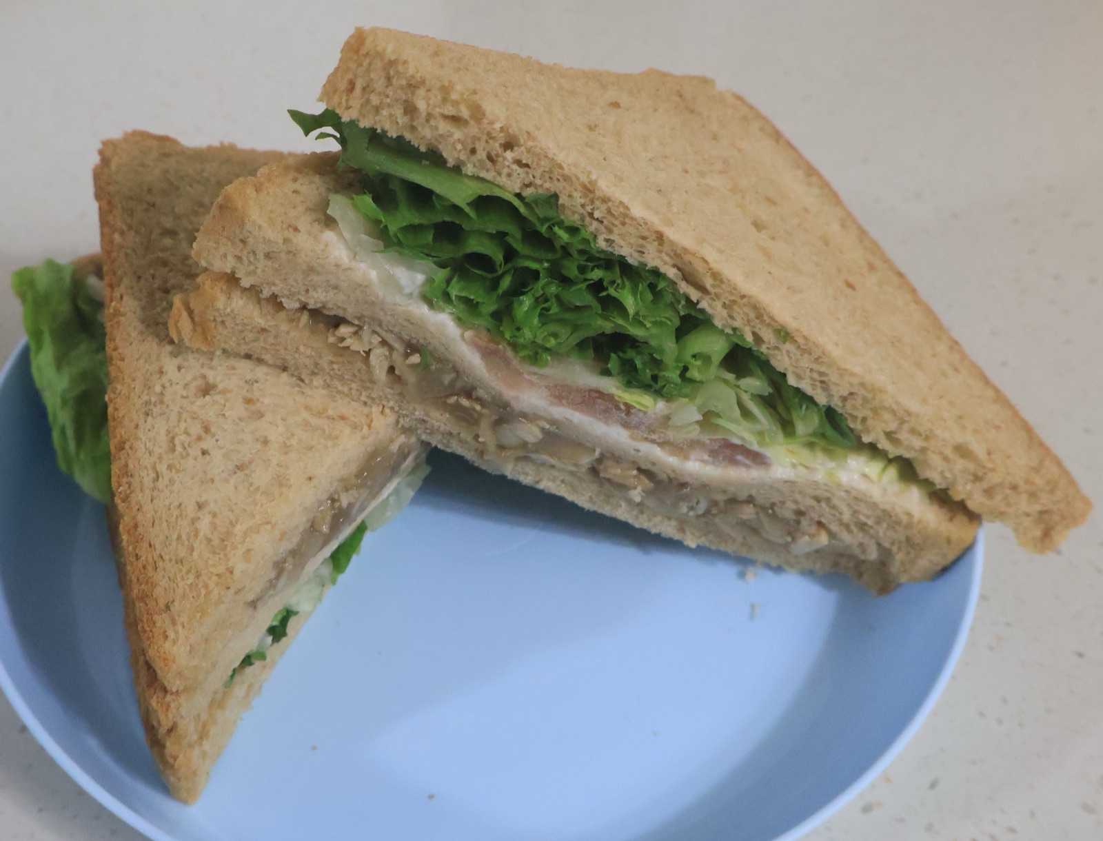 Korean convenience store sandwiches on display in a refrigerated case.