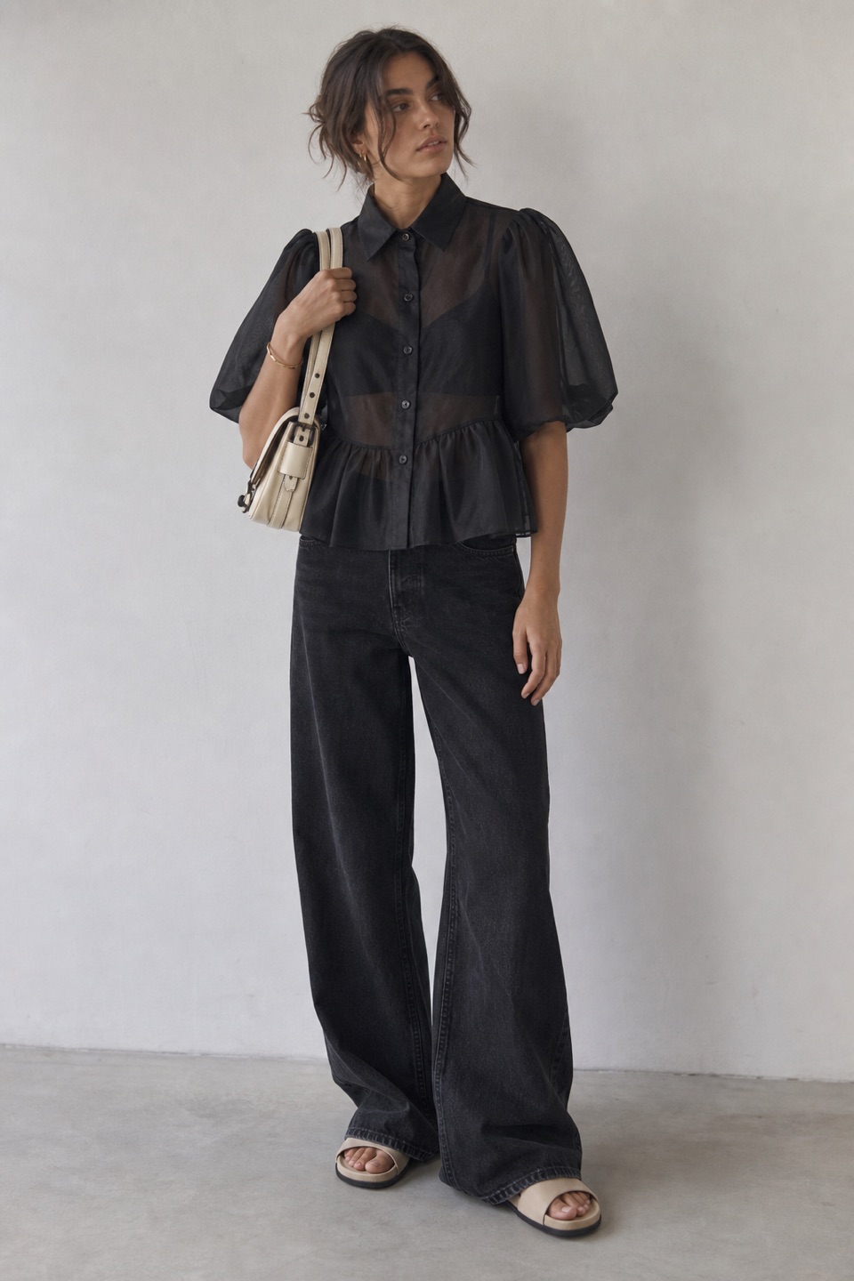 Outfit with Black Peplum Organza Shirt, Black Wide-Leg Jeans, Leather Slide Sandals curated by @dopasnap