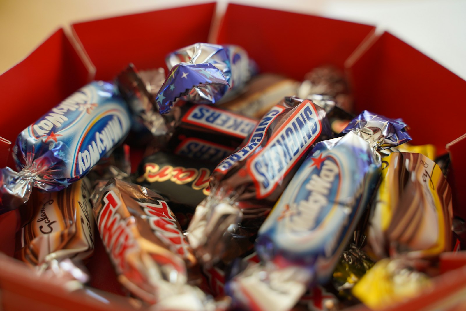 Assorted chocolate candy bars displayed on a shelf