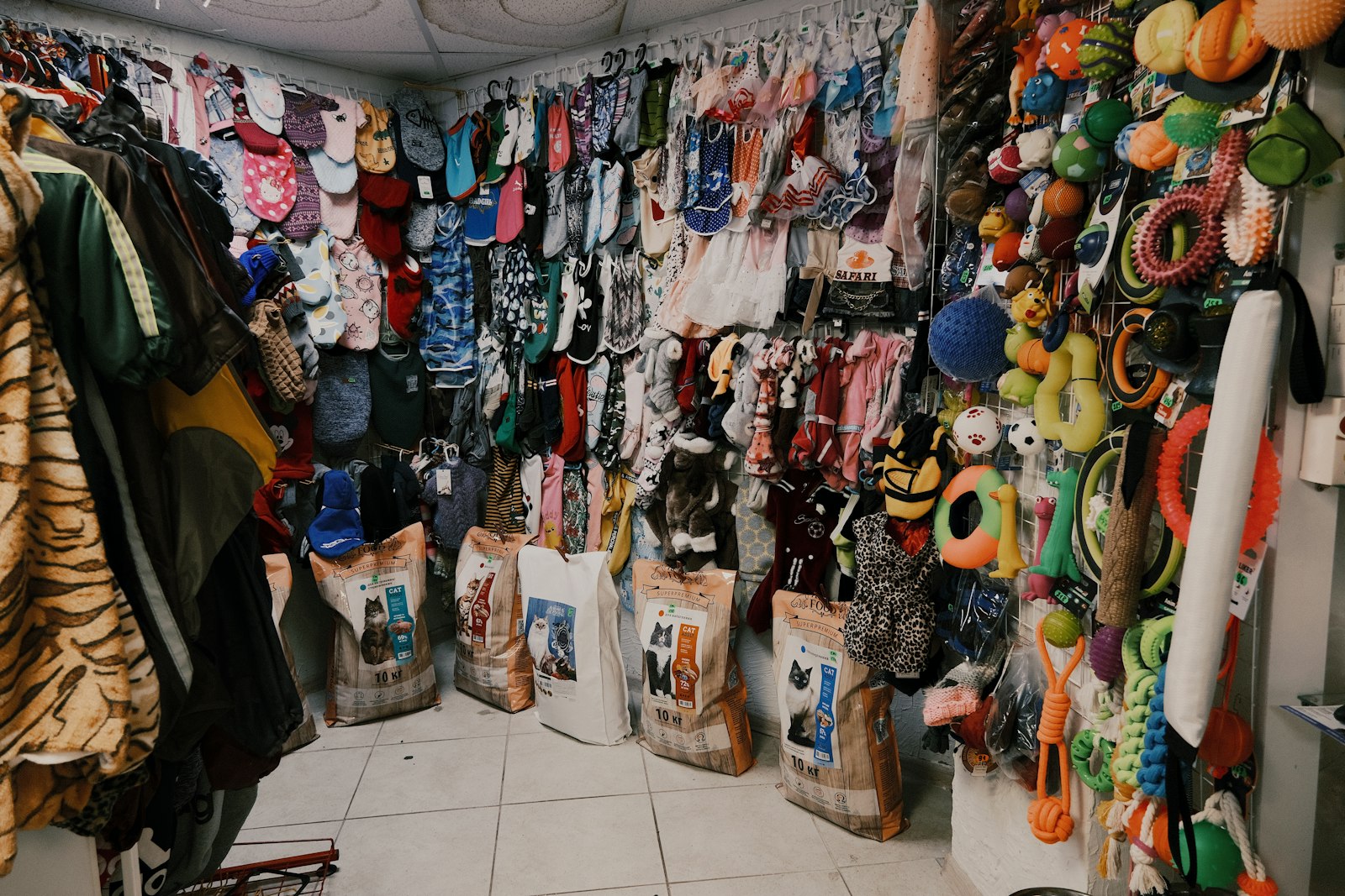 Assorted costumes and clothes hanging on a rental rack