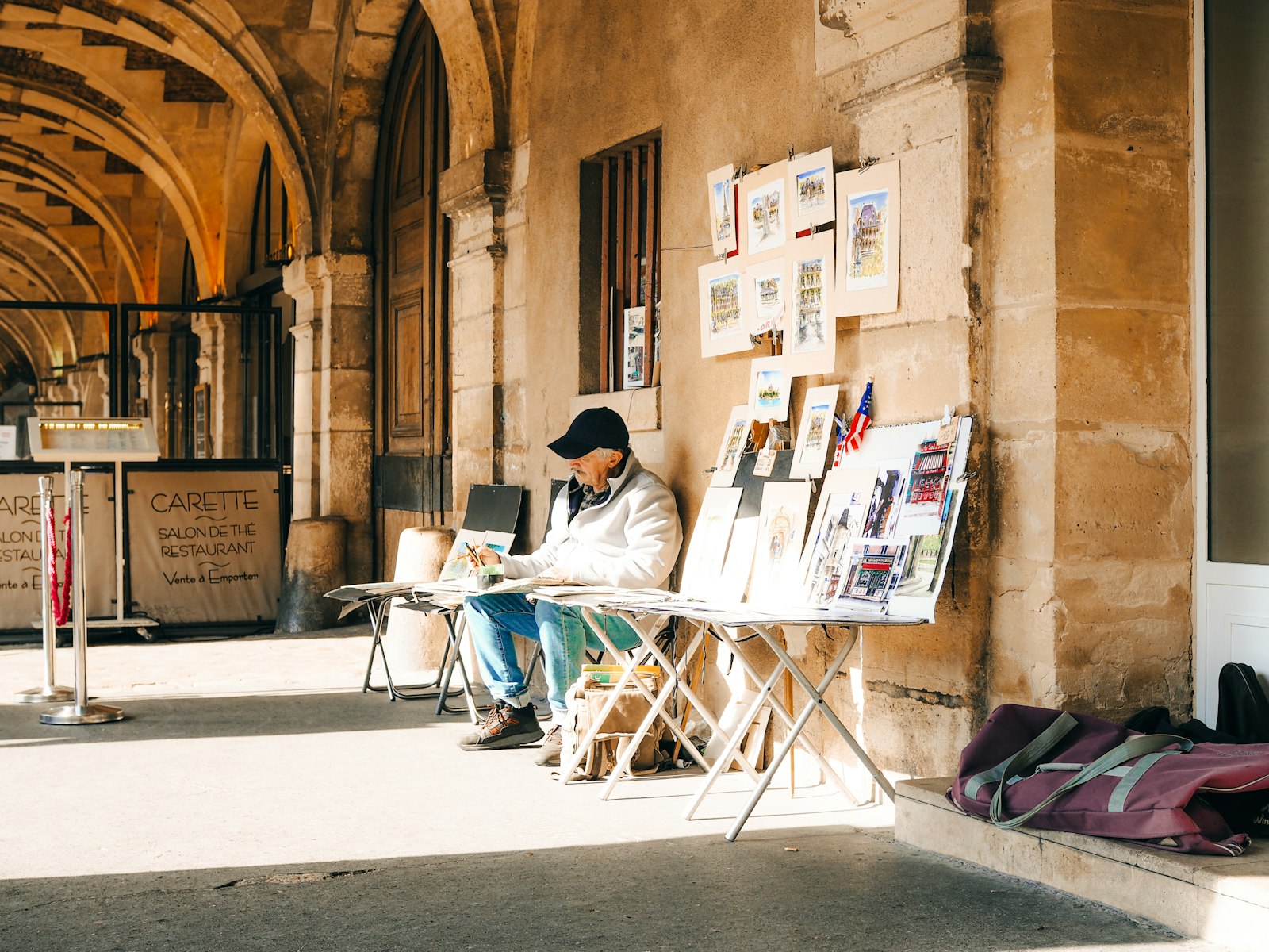 A person relaxing during a career break, sitting outdoors near an archway