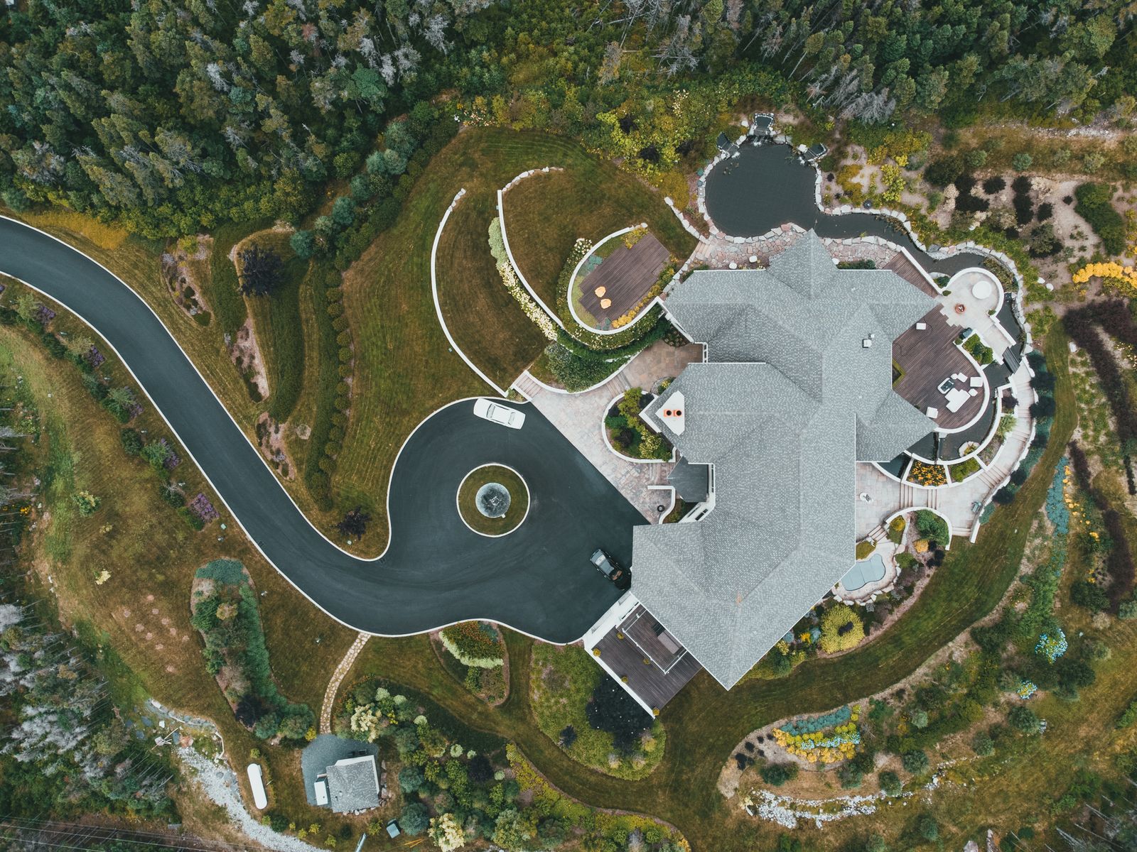 Aerial stock photograph of a large mansion surrounded by landscaped grounds.